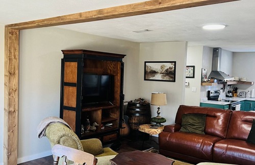 Wilburn Cabin | Cozy riverfront cabin with great outdoor space including a hot tub!