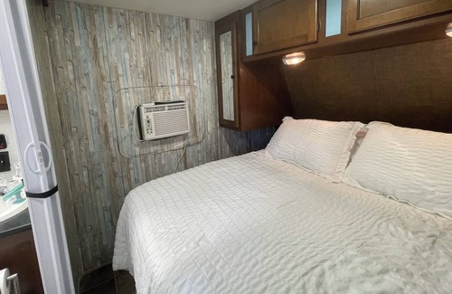 Aztec House | Cozy RV on working farm. 1 bedroom with queen size bed, 2 twin size beds.