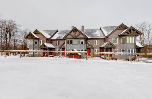 North Troy Condo | Cozy ski-in/ski-out home next to Grammy Jay trail with fireplace, mountain views