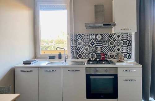 Isola Sacra Apartment | Cozy studio flat with patio, 5 minutes to Fiumicino airport.