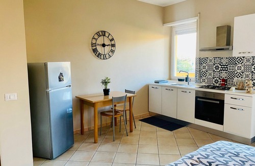 Isola Sacra Apartment | Cozy studio flat with patio, 5 minutes to Fiumicino airport.