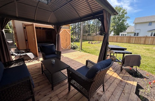 Summerside House | Cozy Summerside Retreat | Hot Tub + Fireplaces