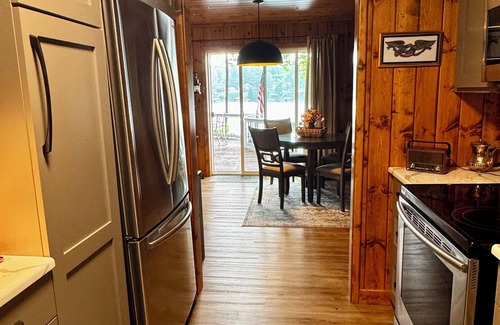 Newaygo Cottage | Cozy Waterfront Cottage - 2 private docks, kayaks, pedal boat, grill & firepit!