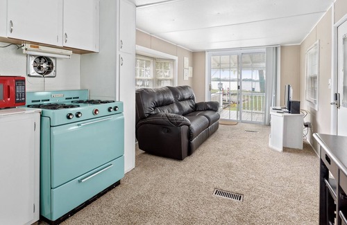 Russells Point Cottage | Cozy Waterfront Cottage on Indian Lake with Boat Slip