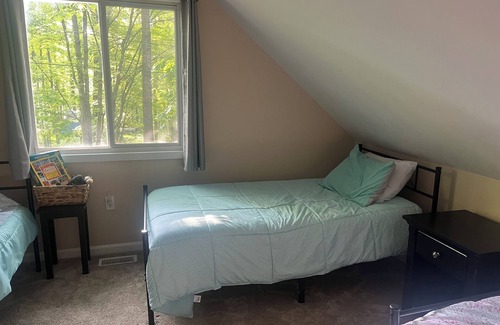 Higgins Lake House | Cozy wooded cabin. Only two minute walk to Higgins lake!