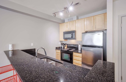 Central Business District Apartment | CozySuites at the Banks gym, pool 13