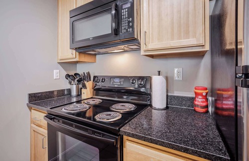 Central Business District Apartment | CozySuites at the Banks gym, pool 13