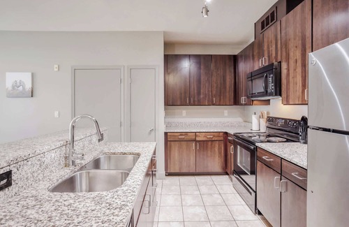Central Business District Apartment | CozySuites at the Banks gym, pool 15