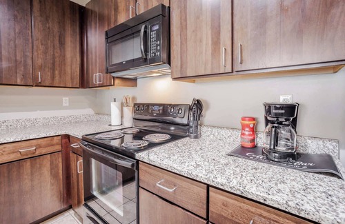 Central Business District Apartment | CozySuites at the Banks gym, pool 15