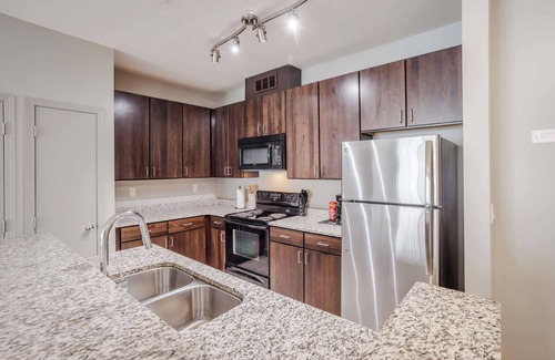 Central Business District Apartment | CozySuites at the Banks gym, pool 15