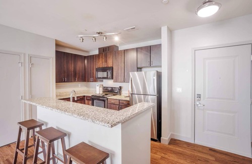 Central Business District Apartment | CozySuites at the Banks gym, pool 14