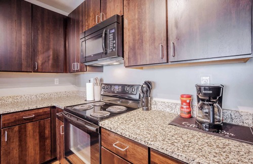 Central Business District Apartment | CozySuites at the Banks gym, pool 14