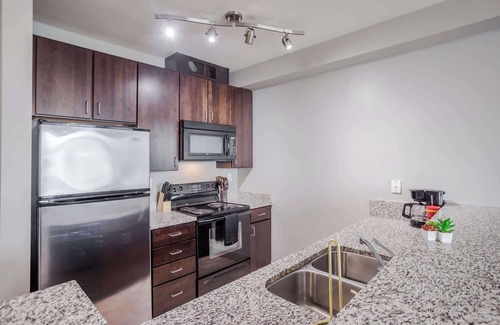 Central Business District Apartment | CozySuites at the Banks gym, pool 12