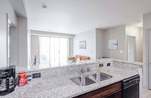 Central Business District Apartment | CozySuites at the Banks gym, pool 12