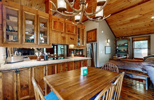 Cashes Valley Cabin | Creekside cabin w/rustic elegance, private hot tub & beautiful screened-in porch