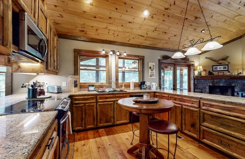 Cashes Valley Cabin | Creekside cabin w/rustic elegance, private hot tub & beautiful screened-in porch