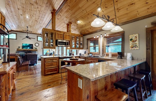 Cashes Valley Cabin | Creekside cabin w/rustic elegance, private hot tub & beautiful screened-in porch