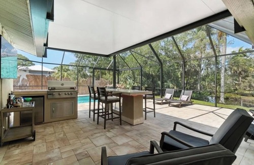 Bonita Springs House | Creekside home with pool and lanai close to downtown Bonita Springs!