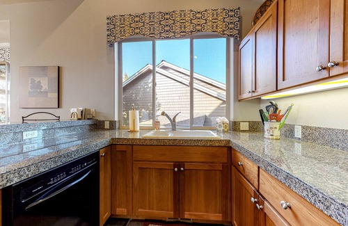 Redmond House | Creekside home with private hot tub & fireplace - access to pools, hot tub, gym