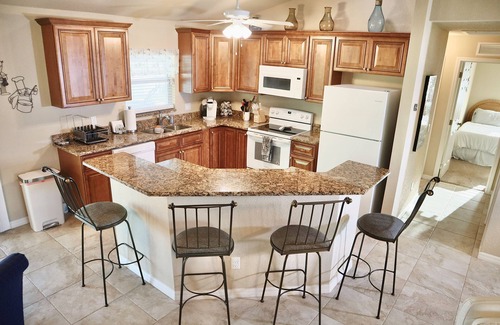 Fort Myers House | Crescent Moon Tranquil Waterfront Hideaway with Heated Saltwater Pool and Spa