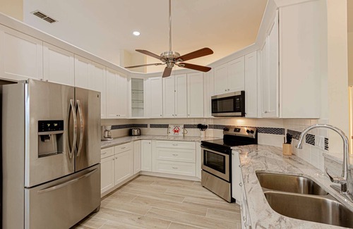 Crown Pointe House | Crown Pointe Heated Pool Home, Covered Lanai w/TV- Renovated w/Coastal Flair, King in Master