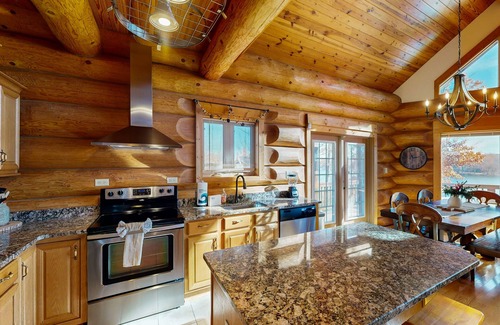 Mineral House | Custom lakefront home with lake views, hot tub, firepit, fireplace, dock, & deck