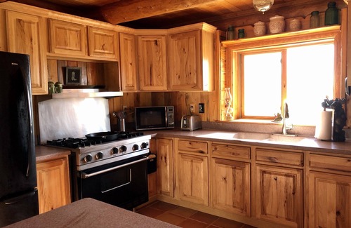 Cody House | Custom Log Cabin with Breathtaking Views of Buffalo Bill Reservoir and Carter Mt