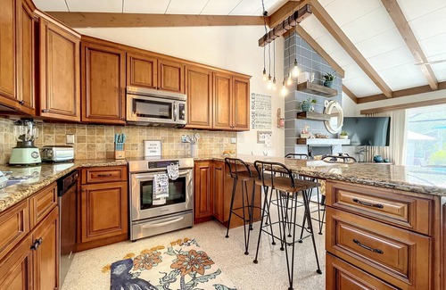 Whitney Beach House | Cute canal front Cottage with dock & boat lift and pool ,short walk to the beach