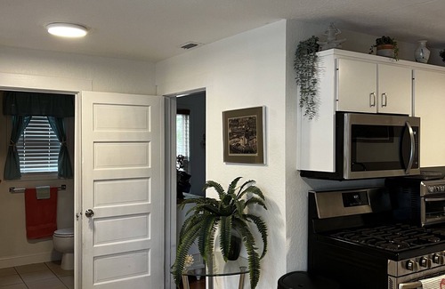 Edgewater House | Cute, comfortable home with a sunny front porch. 3 minute walk to the river.