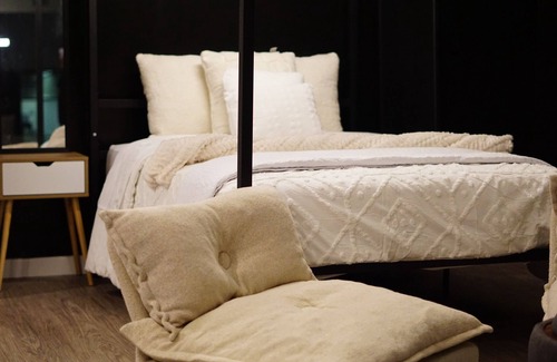 Downtown Winnipeg Apartment | Dark themed minimalist apart at the heart of downtown Winnipeg .