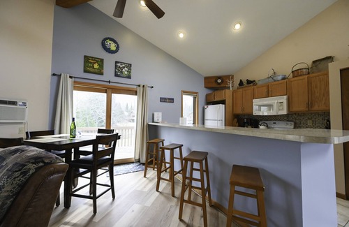 Mancelona Condo | Deck with views! 2 bed 2 bath sleeps 6-8, pool,close to Torch Lake, Boat parking