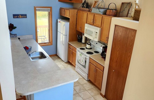 Mancelona Condo | Deck with views! 2 bed 2 bath sleeps 6-8, pool,close to Torch Lake, Boat parking