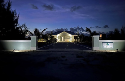 Treasure Cay House | Deep water Canal front home w/dock across the street from the beach.