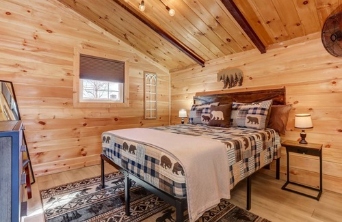 Walnut Mountain Cabin | Deja View - Take in tranquil wooded views and soak in the hot tub!