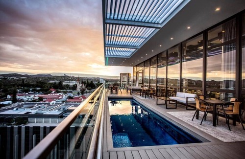 Windhoek Central Apartment | Delight in the Urban Views: Free Parking, Rooftop Pool, Near Alte Feste Museum!