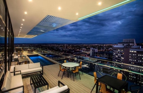 Windhoek Central Apartment | Delight in the Urban Views: Free Parking, Rooftop Pool, Near Alte Feste Museum!