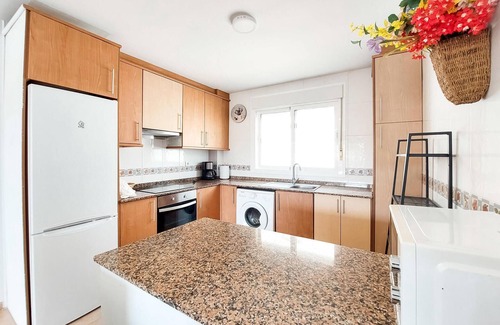 Vinaros Apartment | Delight your family with this beachfront vacation rental with shared outdoor pool.