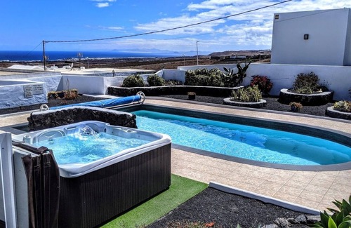 Guime Villa | Delightful child friendly 3 bed villa with fabulous sea views ,hot tub & air con
