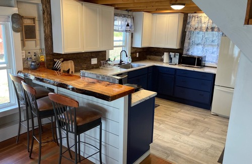 Pleasant Point Cottage | Delightful waterfront cottage with beautiful views of the sunset.