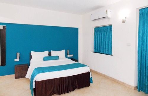 Assagao Apartment | Deluxe Room with one Bedrooms