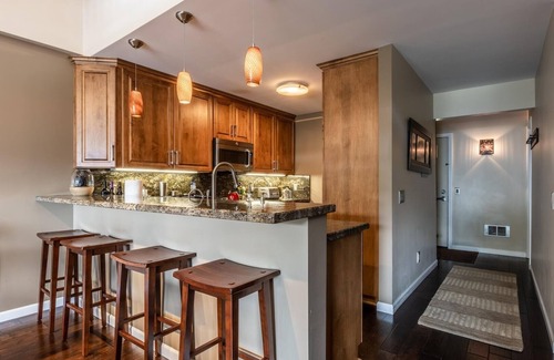 Mammoth Lakes Condo | DELUXE SLOPESIDE Condo with 4th FLOOR VIEWS, Elevator and Underground Parking at Canyon Lodge (1849 Condos 409) by RedAwning
