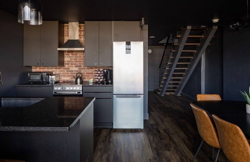 West Main Historic District Condo | DerbyCity Plush Loft. Gather in Style by Hollyhock