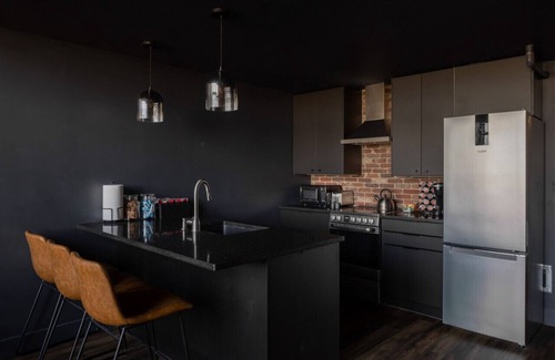 West Main Historic District Condo | DerbyCity Plush Loft. Gather in Style by Hollyhock