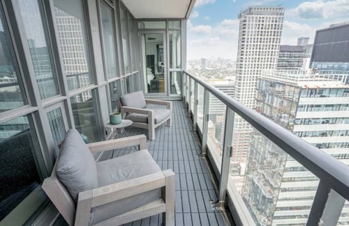 Fashion District Apartment | Designer Penthouse with Grand Piano & Lake Views