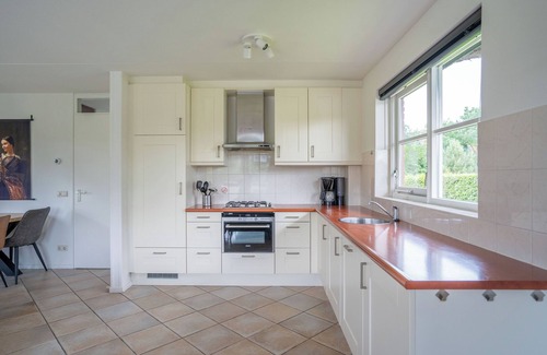 Makkum Cabin | Detached 8-person fisherman's villa with a patio above the water and a private jetty at Beach Resort Makkum on the IJsselmeer.