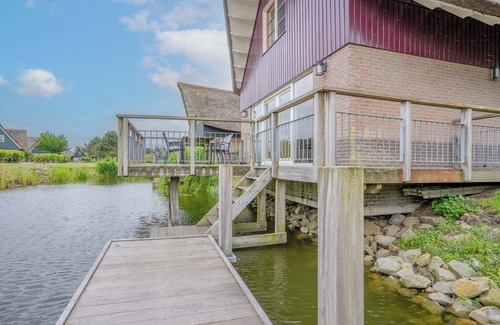 Makkum Cabin | Detached 8-person fisherman's villa with a patio above the water and a private jetty at Beach Resort Makkum on the IJsselmeer.