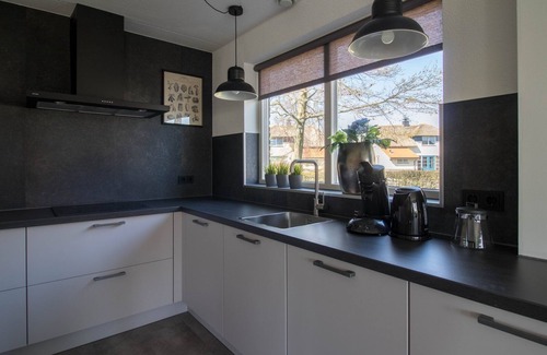 Makkum Cabin | Detached fisherman's villa with sauna, bathtub, and patio above the water at Beach Resort Makkum on the IJsselmeer.