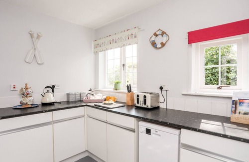 Llangaffo Cottage | DINAM LODGE, character holiday cottage, with open fire in Llangaffo