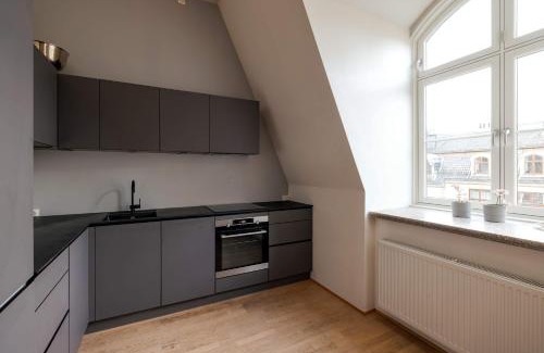 Oslo City Centre Apartment | DINBNB Apartments l Tollbugata Retreat l Rooftop l Smart-TV l 6 Guests