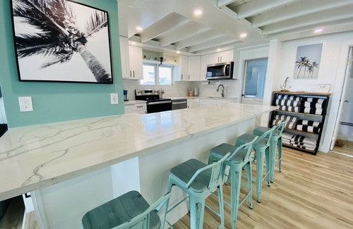 Milford House | Direct Waterfront "The Palms" Beach House